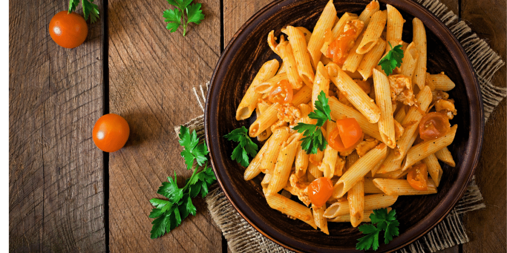 Skillet pasta with ground meat, vegetables, and tomato sauce. Chickpea pasta dish garnished with fresh parsley. Baked feta and tomato pasta, fresh from the oven. Rigatoni in creamy tomato sauce topped with Parmesan cheese